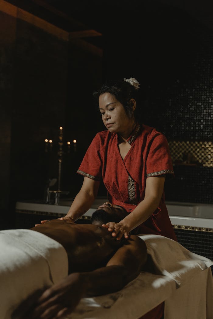 why-choose-us-img Experience a calming massage from an expert masseuse in a dimly lit spa for total relaxation.